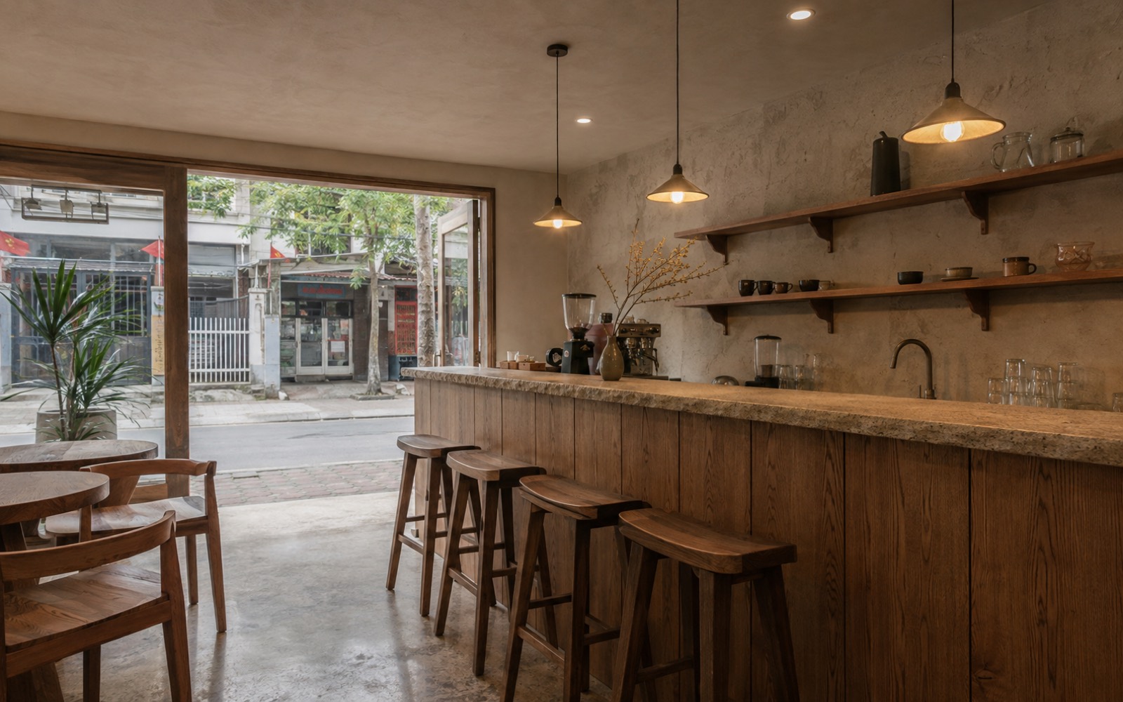 Quán cà phê vừa hoàn thiện với quầy gỗ mặt đá, kệ gắn tường và ghế đẩu gỗ